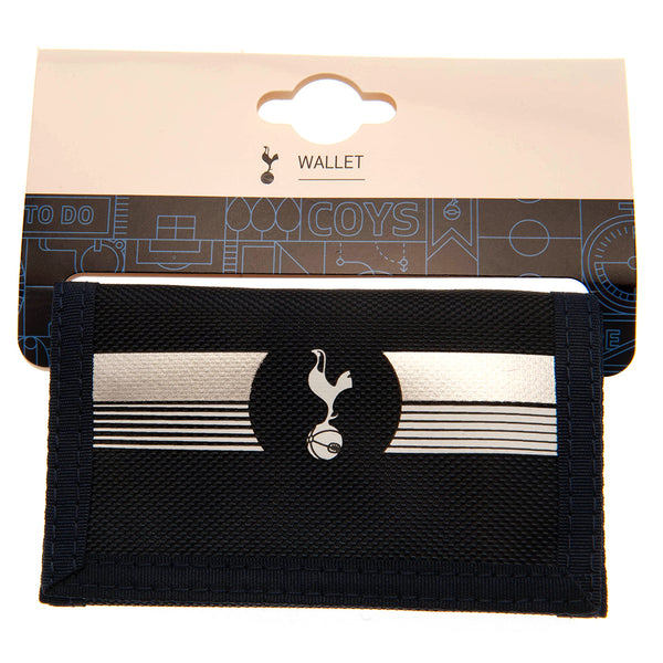 Tottenham Hotspur FC Ultra Wallet LKT Sport Ultra design wallet featuring a full colour club crest5 separate internal compartmentsExternal zipped pocketWipe clean polyesterOfficial licensed productApprox 12cm x 8cm closed Wallets