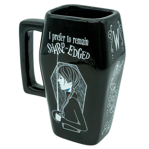Wednesday 3D Coffin Mug LKT Sport 3D sculpted ceramic mugBlack mug with a detailed 3D Wednesday design featuring a coffin and the words 'I prefer to remain Sharp-Edged'Glazed kiln fired finishOfficial licensed productApprox 500ml (17oz)Approx 15cm x 8.5cm