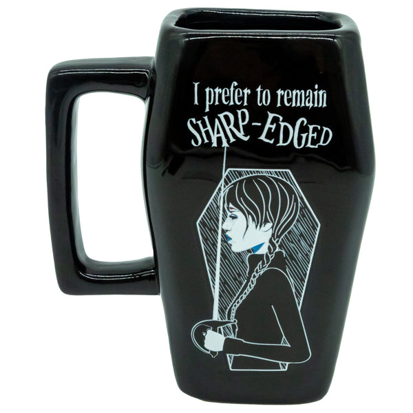 Wednesday 3D Coffin Mug LKT Sport 3D sculpted ceramic mugBlack mug with a detailed 3D Wednesday design featuring a coffin and the words 'I prefer to remain Sharp-Edged'Glazed kiln fired finishOfficial licensed productApprox 500ml (17oz)Approx 15cm x 8.5cm