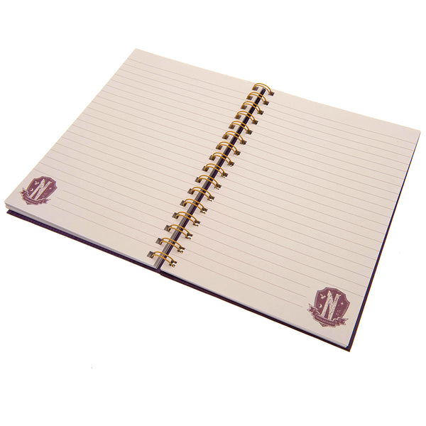Wednesday Notebook LKT Sport Spiral bound hardback A5 notebookPurple notebook featuring the Nevermore Academy crest on the frontLined pages with a small detail logo to the bottomOfficial Licensed MerchandiseApprox 14cm x 21cm Notebooks & Notepads