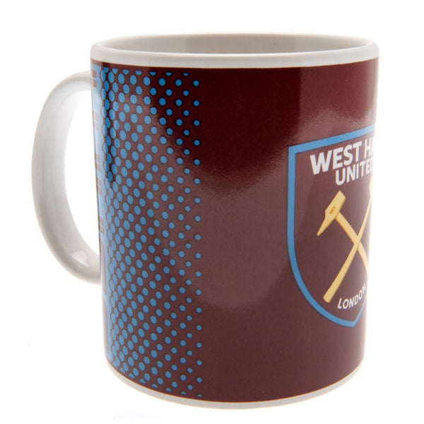 West Ham United FC Fade Mug LKT Sport Ceramic everyday coffee mug Fade design featuring WHUFC text and a full colour club crest Glazed kiln fired finish with white handle Official licensed product Approx 315ml (11oz) Approx 9cm tall, 8cm in diameter In a