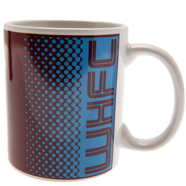 West Ham United FC Fade Mug LKT Sport Ceramic everyday coffee mug Fade design featuring WHUFC text and a full colour club crest Glazed kiln fired finish with white handle Official licensed product Approx 315ml (11oz) Approx 9cm tall, 8cm in diameter In a