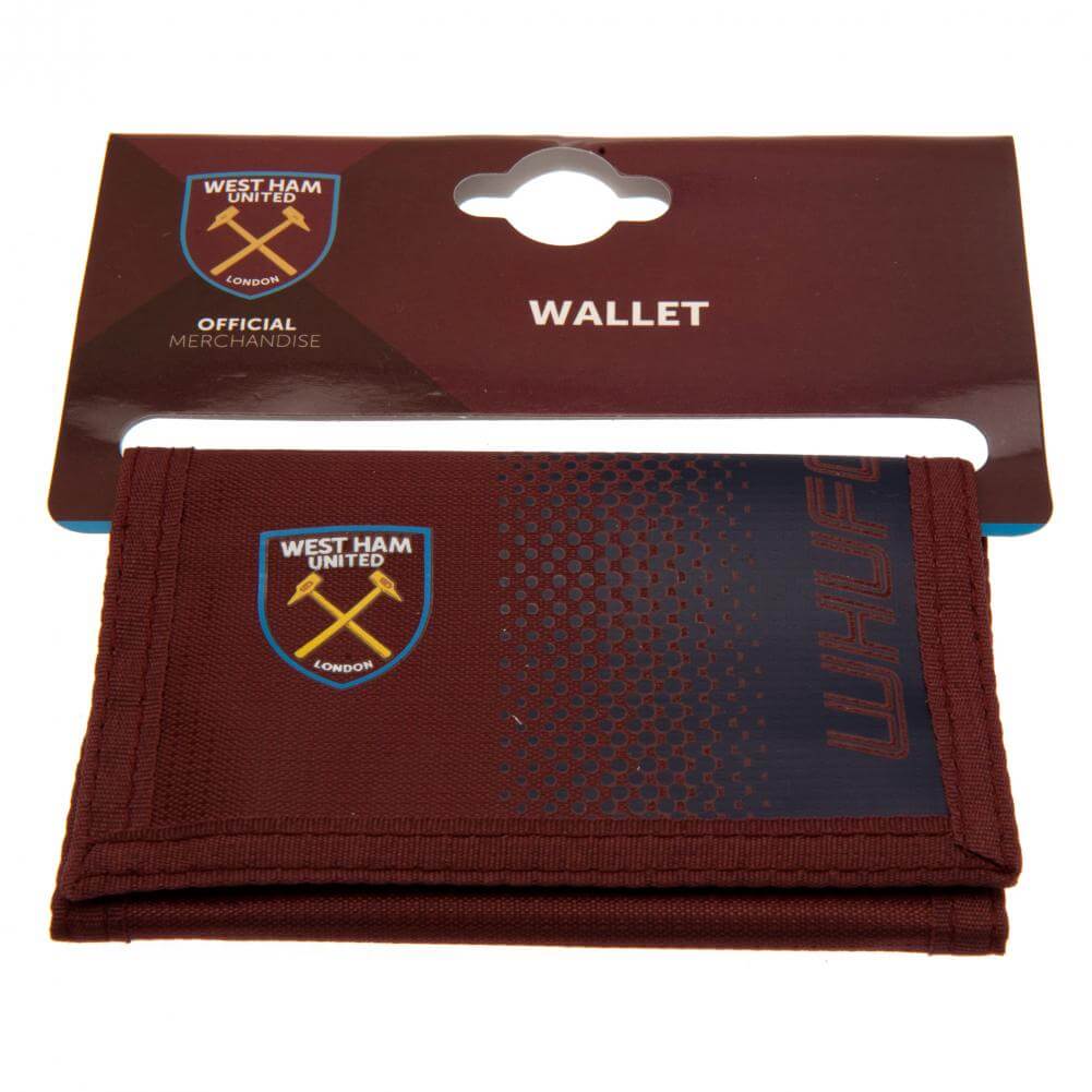 West Ham United FC Fade Wallet LKT Sport Fade design wallet featuring WHUFC text and full colour club crest5 separate internal compartmentsExternal zipped pocketWipe clean polyesterOfficial licensed productApprox 12cm x 8cm closed Wallets
