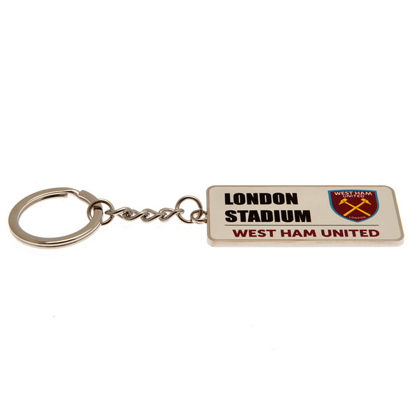 West Ham United FC Street Sign Keyring LKT Sport Metal rectangular keyring with chain and split ringFull colour enamel finish featuring street sign designMetal alloy with silver style finishOfficial licensed productApprox 60mm x 30mm Keychains