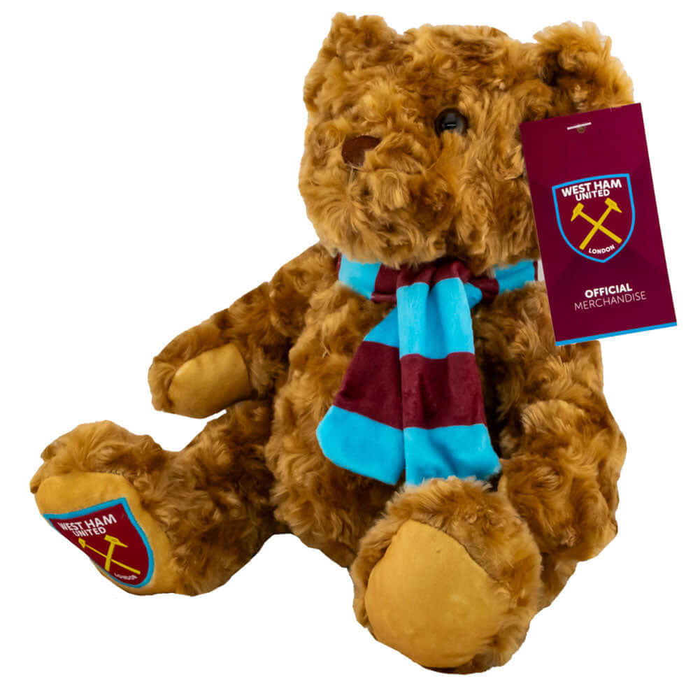 West Ham United FC Supersoft Classic Bear LKT Sport Super soft classic bear in sitting position with beaded eyesWearing a vibrant blue and claret scarf with a West Ham crest on the bears paw100% polyesterOfficial licensed productApprox 23cm in sitting pos