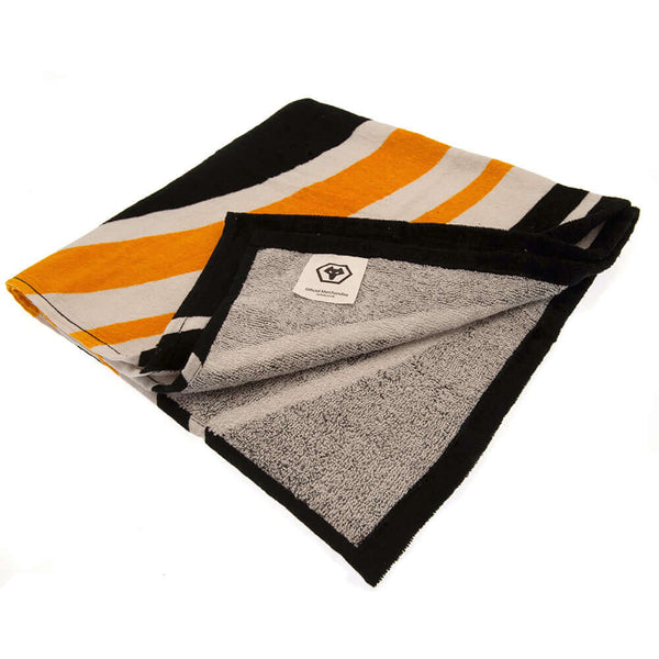 Wolverhampton Wanderers FC Pulse Towel LKT Sport Large soft to touch 100% cotton velour beach towelFeatures a pulse design with a central large crestOfficial licensed productApprox 140cm x 70cm (55in x 28in) Beach Towels